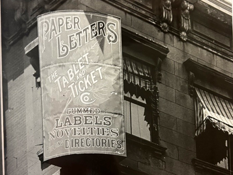 Black-and-white vintage photo of The Tablet & Ticket Co. original business sign